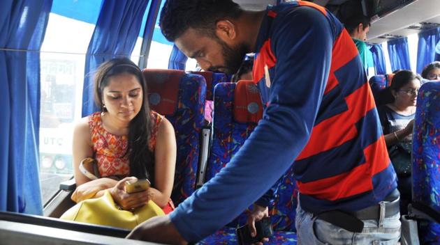 A passenger looks for Wi-Fi details in a high-end bus in Dehradun. (HT Photo) A passenger looks for Wi-Fi details in a high-end bus in Dehradun. (HT Photo)