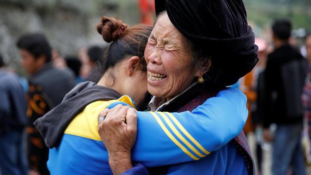 Relatives of victims react at the site of a landslide (REUTERS) Relatives of victims react at the site of a landslide (REUTERS)