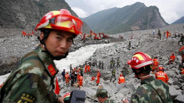 Rescue workers search for survivors at the site of a landslide in the village of Xinmo, Sichuan Province, China. Triggered by heavy rains,the massive landslide buried an entire village with more than ten people confirmed dead and 93 still missing. The landslide carried an estimated 18 million cubic metres of earth and rock equivalent to more than 7,200 Olympic-sized swimming pools. On Monday,villagers in China visited what used to be their relatives’ homes to mourn for their loved ones. (REUTERS) Rescue workers search for survivors at the site of a landslide in the village of Xinmo, Sichuan Province, China. Triggered by heavy rains,the massive landslide buried an entire village with more than ten people confirmed dead and 93 still missing. The landslide carried an estimated 18 million cubic metres of earth and rock equivalent to more than 7,200 Olympic-sized swimming pools. On Monday,villagers in China visited what used to be their relatives’ homes to mourn for their loved ones. (REUTERS)