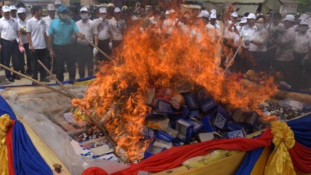 Cambodian officials burn a pile of drugs during a destruction ceremony in Phnom Penh. (AFP) Cambodian officials burn a pile of drugs during a destruction ceremony in Phnom Penh. (AFP)