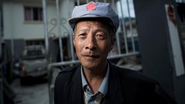 Yang Renyi who is seeking compensation money for his old house poses for a portrait in front of his new house near Lianghekou. Beginning in the 1990s, more than a million were moved for the Three Gorges Dam, the world’s largest in terms of capacity with thousands still mired in poverty. (AFP) Yang Renyi who is seeking compensation money for his old house poses for a portrait in front of his new house near Lianghekou. Beginning in the 1990s, more than a million were moved for the Three Gorges Dam, the world’s largest in terms of capacity with thousands still mired in poverty. (AFP)