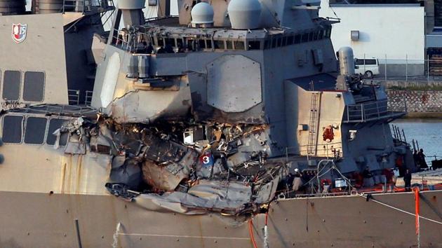 The Arleigh Burke-class guided-missile destroyer USS Fitzgerald, damaged by colliding with a Philippine-flagged merchant vessel, is towed into the U.S. naval base in Yokosuka, south of Tokyo. (REUTERS) The Arleigh Burke-class guided-missile destroyer USS Fitzgerald, damaged by colliding with a Philippine-flagged merchant vessel, is towed into the U.S. naval base in Yokosuka, south of Tokyo. (REUTERS)