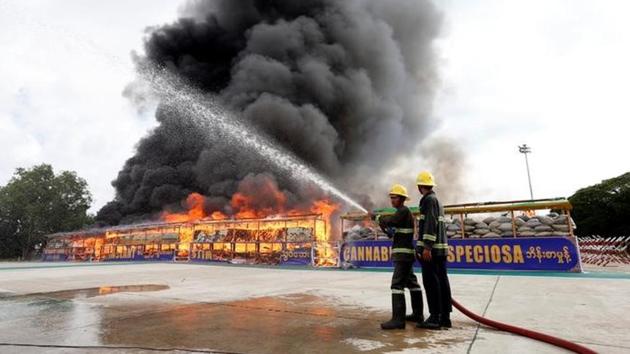 Firefighters prepare to distinguish fire after burning seized drugs at an event to mark International Day against Drug Abuse and Illicit Trafficking, outside Yangon, Myanmar. (Reuters) Firefighters prepare to distinguish fire after burning seized drugs at an event to mark International Day against Drug Abuse and Illicit Trafficking, outside Yangon, Myanmar. (Reuters)