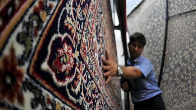 The making of carpets has traditionally been done by hand and has been a laborious process, with the Nakaash or artisan involved in the cultivation of fine silk, the intricate layout, weaving and final finishing taking months. (Nitin Kanotra/HT Photo) The making of carpets has traditionally been done by hand and has been a laborious process, with the Nakaash or artisan involved in the cultivation of fine silk, the intricate layout, weaving and final finishing taking months. (Nitin Kanotra/HT Photo)