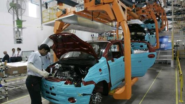 A worker assembles a new vehicle on the assembly line at the General Motors Corp. in Talegaon, near Mumbai. (AP File Photo) A worker assembles a new vehicle on the assembly line at the General Motors Corp. in Talegaon, near Mumbai. (AP File Photo)