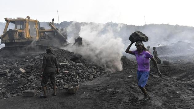 People work in an open-cast coal mine at Jharia in Jharkhand. (Ravi Choudhary/HT PHOTO) People work in an open-cast coal mine at Jharia in Jharkhand. (Ravi Choudhary/HT PHOTO)