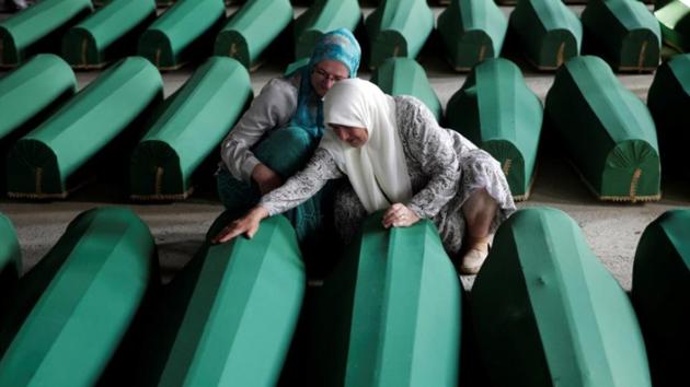 Muslim women cry near coffins of their relatives, who are newly identified victims of the 1995 Srebrenica massacre, which are lined up for a joint burial in Potocari near Srebrenica, Bosnia and Herzegovina. (Reuters File) Muslim women cry near coffins of their relatives, who are newly identified victims of the 1995 Srebrenica massacre, which are lined up for a joint burial in Potocari near Srebrenica, Bosnia and Herzegovina. (Reuters File)