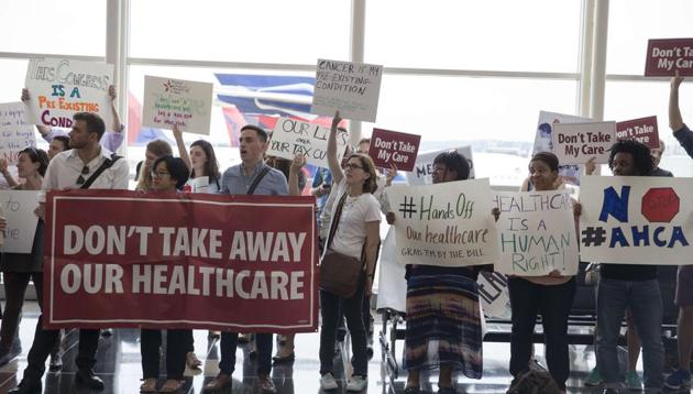 Protesters greet senators leaving Ronald Regan Washington National Airport in Washington, DC. People came out to voice their views on the upcoming healthcare vote on Capital Hill.(AFP File Photo) Protesters greet senators leaving Ronald Regan Washington National Airport in Washington, DC. People came out to voice their views on the upcoming healthcare vote on Capital Hill.(AFP File Photo)