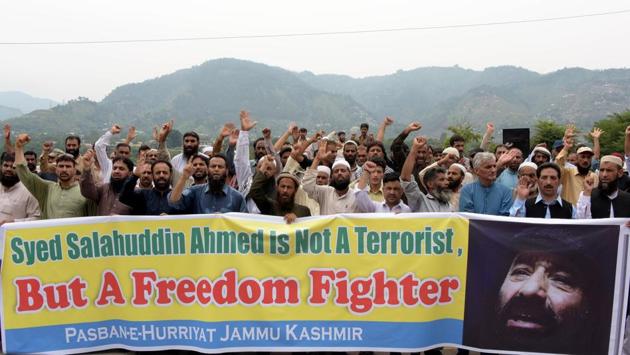 Pakistani activists carry a banner as they shout slogans during a protest against United States' sanctions on Syed Salahuddin. (AFP) Pakistani activists carry a banner as they shout slogans during a protest against United States' sanctions on Syed Salahuddin. (AFP)