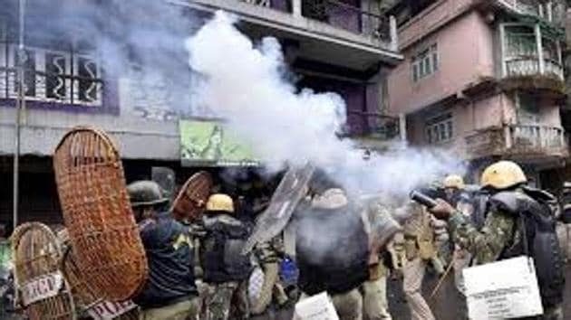 Police firing tear gas shells in Darjeeling on June 17. (HT Photo) Police firing tear gas shells in Darjeeling on June 17. (HT Photo)