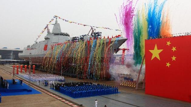 A photo on the navy’s website showed multicolored streamers being shot out of tubes while sailors and shipyard workers stood dockside next to a massive Chinese flag. (Ministry of National Defence website) A photo on the navy’s website showed multicolored streamers being shot out of tubes while sailors and shipyard workers stood dockside next to a massive Chinese flag. (Ministry of National Defence website)
