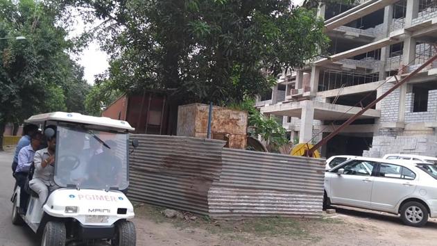 Union health secretary and other officials inspecting the 250-bedded hospital coming up near Gate No. 2 at the PGIMER in Chandigarh on Tuesday. (HT photo) Union health secretary and other officials inspecting the 250-bedded hospital coming up near Gate No. 2 at the PGIMER in Chandigarh on Tuesday. (HT photo)