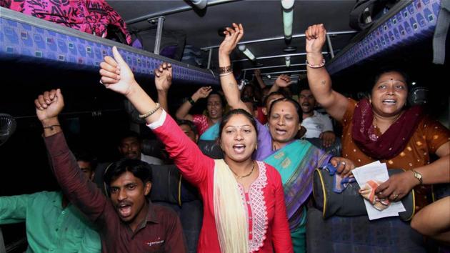 Devotees shout religious slogans in a bus as the first batch of pilgrims left for Amarnath Yatra, in Jammu. (PTI)