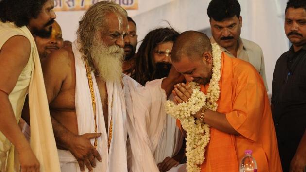 Chief minister of Uttar Pradesh Yogi Adityanath attending the birthday celebrations of Nritya Gopal Das in Ayodhya on Wednesday.(Deepak Gupta/Hindustan Times)