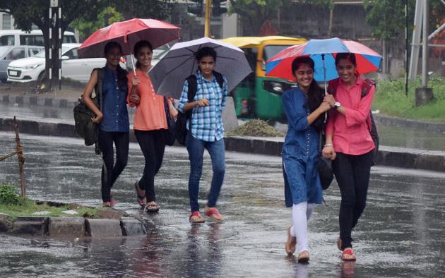 Girls enjoying rain in Chandigarh on Wednesday. (Karun Sharma/HT)