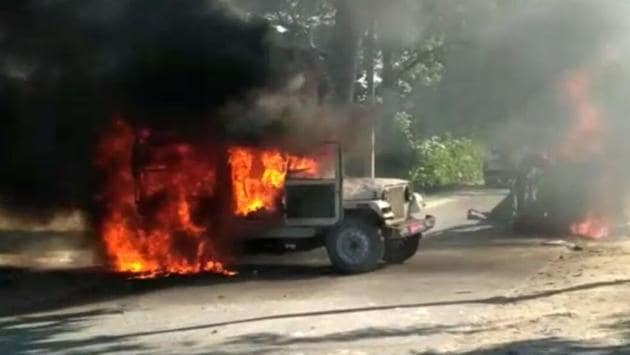 One of the police vehicles that was set on fire by an irate mob in Siwan on Wednesday.