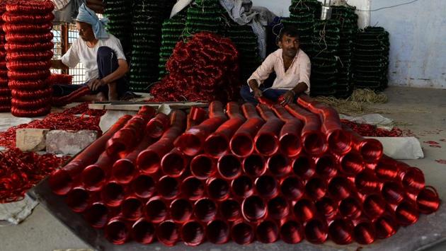 A worker packs glass bangles at a factory in Firozabad. Artisans working in these units earn little more than Rs 300 per day, despite the extreme conditions. (Sajjad Hussain /AFP) A worker packs glass bangles at a factory in Firozabad. Artisans working in these units earn little more than Rs 300 per day, despite the extreme conditions. (Sajjad Hussain /AFP)