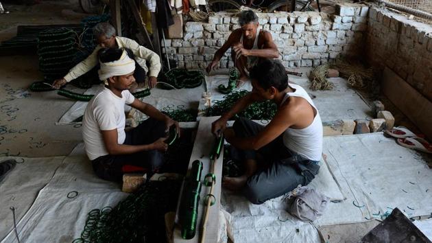 To offset the disruption, the government is trying to bring artisans into the modern era, teaching them to sell their goods online and run stalls at state-run craft fairs in major centres. (Sajjad Hussain /AFP) To offset the disruption, the government is trying to bring artisans into the modern era, teaching them to sell their goods online and run stalls at state-run craft fairs in major centres. (Sajjad Hussain /AFP)