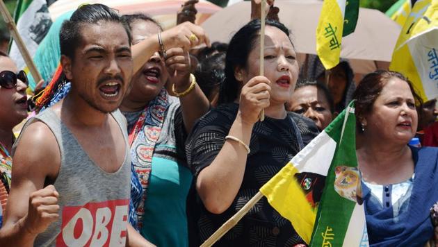 Supporters of the Gorkha Janmukti Morcha (GJM) chant slogans before burning copies of the Gorkhaland Territorial Administration (GTA) agreement during a protest in Dagapur village on the outskirts of Siliguri on June 27, 2017. (AFP) Supporters of the Gorkha Janmukti Morcha (GJM) chant slogans before burning copies of the Gorkhaland Territorial Administration (GTA) agreement during a protest in Dagapur village on the outskirts of Siliguri on June 27, 2017. (AFP)