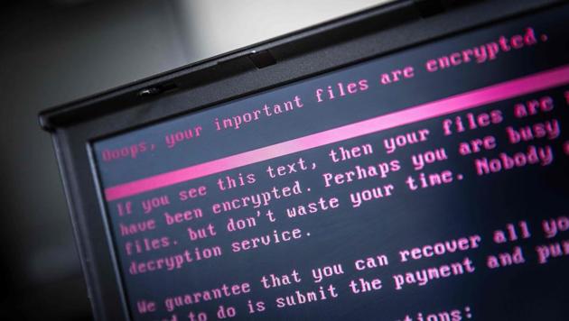 A laptop displays a message after being infected by a ransomware as part of a worldwide cyberattack on June 27, 2017 in Geldrop. (AFP) A laptop displays a message after being infected by a ransomware as part of a worldwide cyberattack on June 27, 2017 in Geldrop. (AFP)