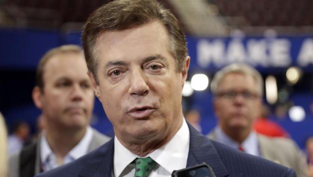 Former Donald Trump campaign chairman Paul Manafort talks to reporters on the floor of the Republican National Convention, in Cleveland.(AP File Photo)