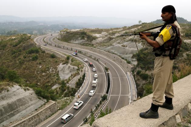 A paramilitary soldier stands guard overlooking a highway as the first batch of Hindu pilgrims leave for Amarnath Yatra on Wednesday. (HT photo) A paramilitary soldier stands guard overlooking a highway as the first batch of Hindu pilgrims leave for Amarnath Yatra on Wednesday. (HT photo)
