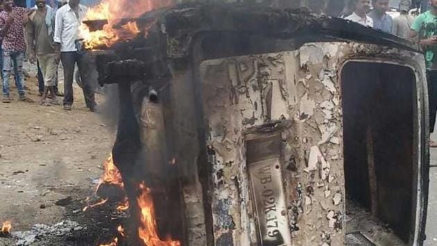 Pictures circulating on social media showed people hitting the man, meat pieces strewn on the road, and his car in flames.(HT) Pictures circulating on social media showed people hitting the man, meat pieces strewn on the road, and his car in flames.(HT)