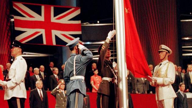 The Chinese flag is raised by People's Liberation Army soldiers to signal Hong Kong's return to Chinese sovereignty after 156 years of British rule. Hong Kong is marking 20 years since the territory was handed from Britain to China, bringing an end to more than 150 years of colonial rule. (Dylan Martinez / Reuters) The Chinese flag is raised by People's Liberation Army soldiers to signal Hong Kong's return to Chinese sovereignty after 156 years of British rule. Hong Kong is marking 20 years since the territory was handed from Britain to China, bringing an end to more than 150 years of colonial rule. (Dylan Martinez / Reuters)