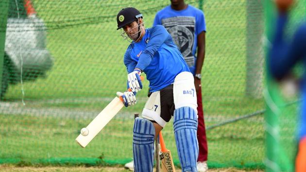 India's MS Dhoni plays a shot during the net practice. (AFP)