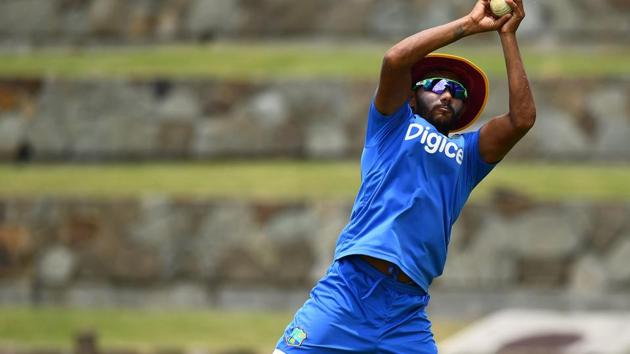 West Indies' Devendra Bishoo catches a ball during practice at the Sir Vivian Richards Cricket Ground, where they will host India in the 3rd ODI. (AFP)