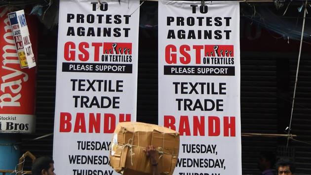 Banners protesting against the forthcoming Goods and Services Tax in Kolkata. (AFP) Banners protesting against the forthcoming Goods and Services Tax in Kolkata. (AFP)
