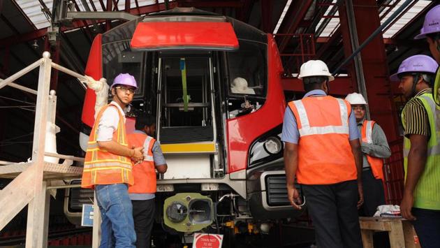 Workers inspect a train carriage at the Lucknow Metro Depot. (Subhankar Chakraborty/HT Photo) Workers inspect a train carriage at the Lucknow Metro Depot. (Subhankar Chakraborty/HT Photo)
