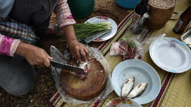 Made from raw fish, live red ants, herbs and lime juice, Koi pla is eaten soon after it is prepared. (Lillian Suwanrumpha/AFP) Made from raw fish, live red ants, herbs and lime juice, Koi pla is eaten soon after it is prepared. (Lillian Suwanrumpha/AFP)