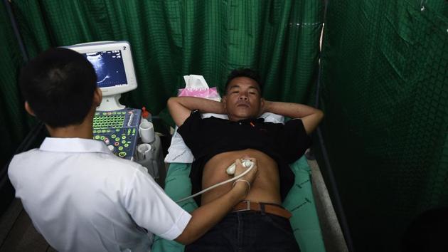 A man undergoes an ultrasound during a CASCAP event in the Thai province of Kalasin. One of the major causes of the Cholangiocarcinoma (CCA) a bile duct cancer, is a parasitic flatworm or fluke native to the Mekong region and found in many freshwater fish. (Lillian Suwanrumpha/AFP) A man undergoes an ultrasound during a CASCAP event in the Thai province of Kalasin. One of the major causes of the Cholangiocarcinoma (CCA) a bile duct cancer, is a parasitic flatworm or fluke native to the Mekong region and found in many freshwater fish. (Lillian Suwanrumpha/AFP)