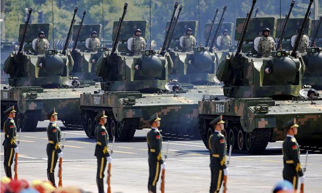 People's Liberation Army soldiers and armoured vehicles equipped with anti-aircraft artillery at Tiananmen Square during a military parade.(Reuters File) People's Liberation Army soldiers and armoured vehicles equipped with anti-aircraft artillery at Tiananmen Square during a military parade.(Reuters File)