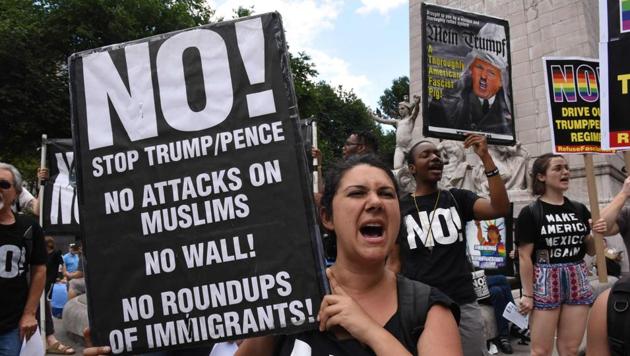 Protesters at Columbus Circle in New York City June 26, 2017 prior to a march to Trump Tower to denounce the Supreme Court's reinstatement of large parts of the Trump travel ban. (AFP Photo) Protesters at Columbus Circle in New York City June 26, 2017 prior to a march to Trump Tower to denounce the Supreme Court's reinstatement of large parts of the Trump travel ban. (AFP Photo)