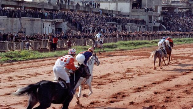 Jockeys compete during a horse race in 1992 at the Hippodrome in Beirut , Lebanon. (Jamal Saidi/REUTERS) Jockeys compete during a horse race in 1992 at the Hippodrome in Beirut , Lebanon. (Jamal Saidi/REUTERS)