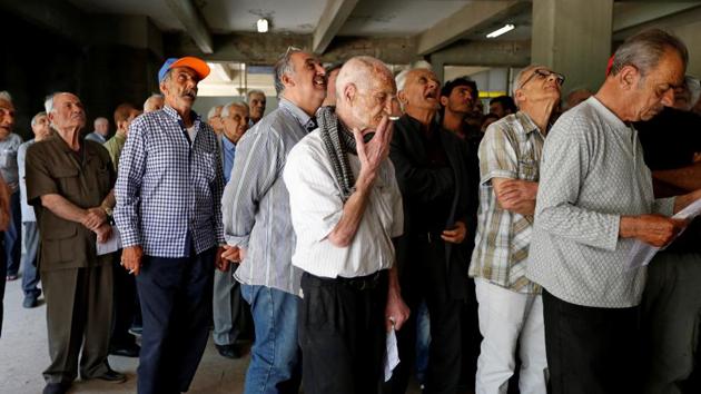 Racegoers queue at a betting stall at the Beirut stadium. Officials have proposed using a rare patch of green in Beirut’s centre as a park on days when there are no races. (Jamal Saidi/REUTERS) Racegoers queue at a betting stall at the Beirut stadium. Officials have proposed using a rare patch of green in Beirut’s centre as a park on days when there are no races. (Jamal Saidi/REUTERS)