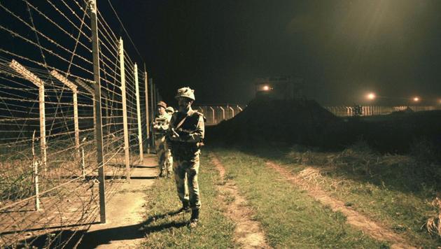 Border Security Force (BSF) soldiers standing guard during a night patrol near the fence at the India-Pakistan International Border at the outpost of Akhnoor sector, about 40 km from Jammu. (Nitin Kantora/HT FILE PHOTO) Border Security Force (BSF) soldiers standing guard during a night patrol near the fence at the India-Pakistan International Border at the outpost of Akhnoor sector, about 40 km from Jammu. (Nitin Kantora/HT FILE PHOTO)