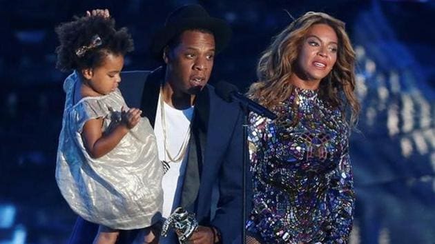 Jay-Z presents the Video Vanguard Award to his wife Beyonce as he holds their daughter Blue Ivy during the 2014 MTV Video Music Awards in Inglewood. Jay-Z presents the Video Vanguard Award to his wife Beyonce as he holds their daughter Blue Ivy during the 2014 MTV Video Music Awards in Inglewood.