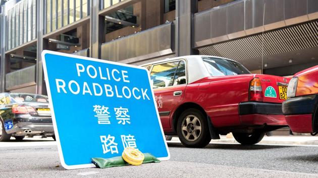 A police roadblock sign is placed in the area where Chinese President Xi Jinping is staying during his visit in Hong Kong on June 30, 2017. (AFP Photo) A police roadblock sign is placed in the area where Chinese President Xi Jinping is staying during his visit in Hong Kong on June 30, 2017. (AFP Photo)