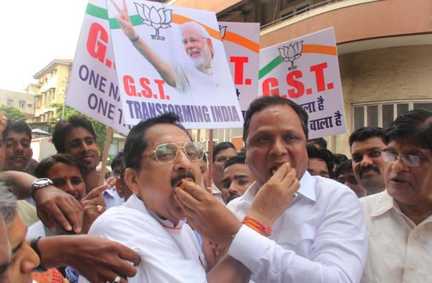 BJP leaders Raj Purohit and Ashish Shelar at a rally celebrating the GST roll out on Friday.(Bhushan Koyande)