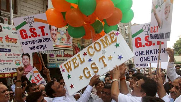 BJP party workers with MLA Raj Purohit, Akash Raj Purohit, Ashish Shelar celebrate implementing of “GST” one nation one tax which will be on effect tomorrow at Kalwadevi , in Mumbai, India, on Friday, 30 June, 2017.(HT Archive) BJP party workers with MLA Raj Purohit, Akash Raj Purohit, Ashish Shelar celebrate implementing of “GST” one nation one tax which will be on effect tomorrow at Kalwadevi , in Mumbai, India, on Friday, 30 June, 2017.(HT Archive)