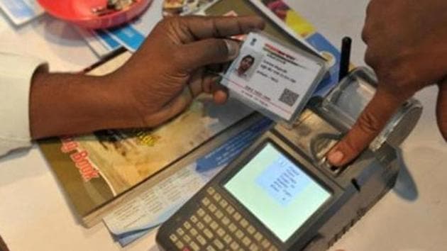 A man gives a thumb impression to withdraw money from his bank account with his Aadhaar or Unique Identification (UID) card in Hyderabad. (AFP file) A man gives a thumb impression to withdraw money from his bank account with his Aadhaar or Unique Identification (UID) card in Hyderabad. (AFP file)