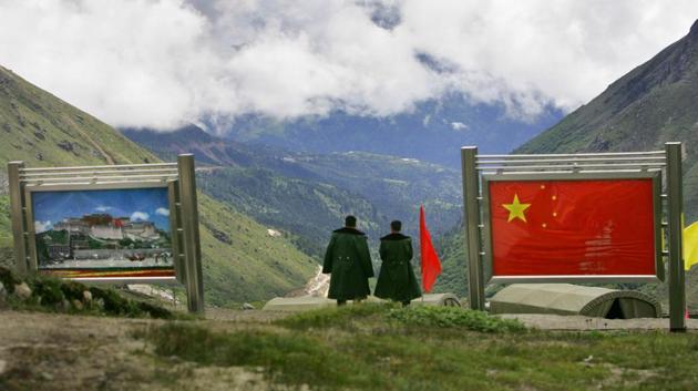 Chinese army officers oversee preparations as they stand on the Chinese side of the international border at Nathula Pass, in Sikkim, Wednesday, July 5, 2006. (AP) Chinese army officers oversee preparations as they stand on the Chinese side of the international border at Nathula Pass, in Sikkim, Wednesday, July 5, 2006. (AP)