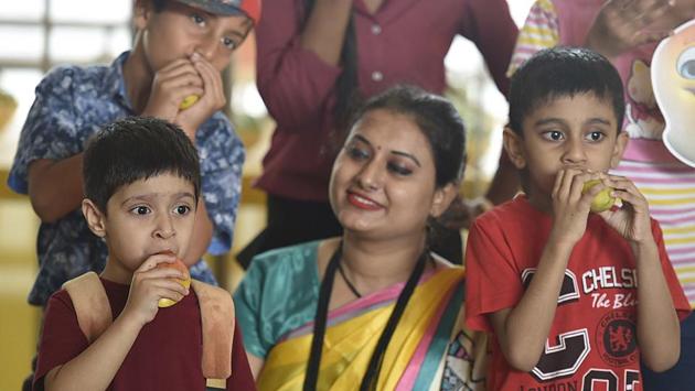 Children relish the mangoes during the Mango Festival at Dilli Haat. (Raj K Raj/HT PHOTO) Children relish the mangoes during the Mango Festival at Dilli Haat. (Raj K Raj/HT PHOTO)