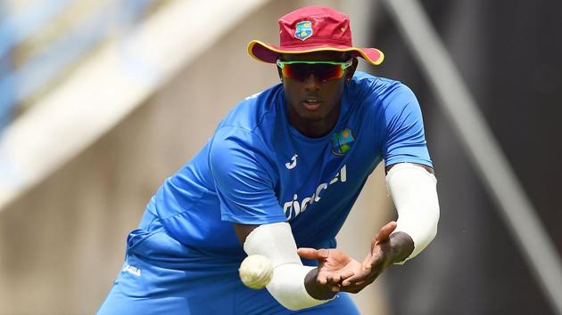 West Indies' captain Jason Holder catches a ball during a practice session at the Sir Vivian Richards Cricket Ground in St. John's, Antigua.(AFP)