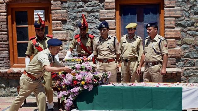 Director general of Jammu and Kashmir Police S P Vaid laying a wreath at the coffin of slain DSP Mohammed Ayub Pandit in Srinagar, June 23, 2017. Pandit was lynched by the mob outside Jamia Masjid. (PTI) Director general of Jammu and Kashmir Police S P Vaid laying a wreath at the coffin of slain DSP Mohammed Ayub Pandit in Srinagar, June 23, 2017. Pandit was lynched by the mob outside Jamia Masjid. (PTI)