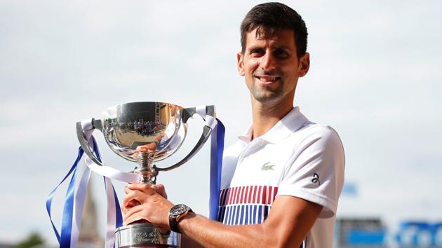 Serbia's Novak Djokovic celebrates with the trophy after winning the final against France's Gael Monfils at the Aegon International in Eastbourne on July 1.(Reuters)