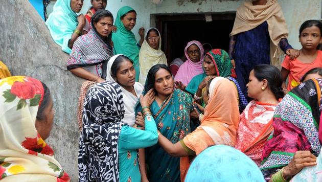 “Mob justice would be meted with mob-justice,” said Mariam Khatun (centre in green), the wife of the dead trader, as scores of people flooded her modest home to console her.(Parwaz Khan/ Hindustan Times)